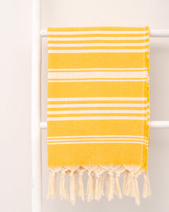 striped yellow hammam towel made of recycled cotton