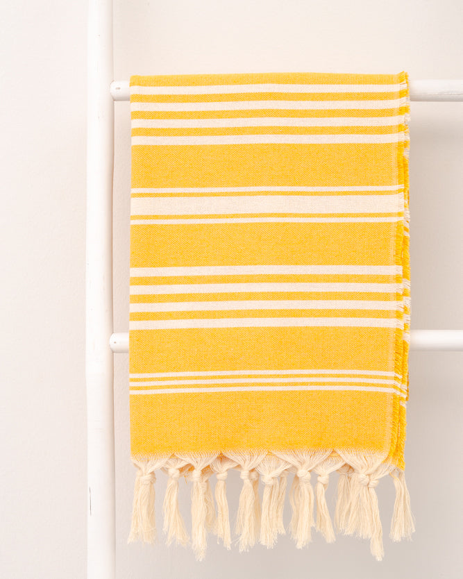 striped yellow hammam towel made of recycled cotton